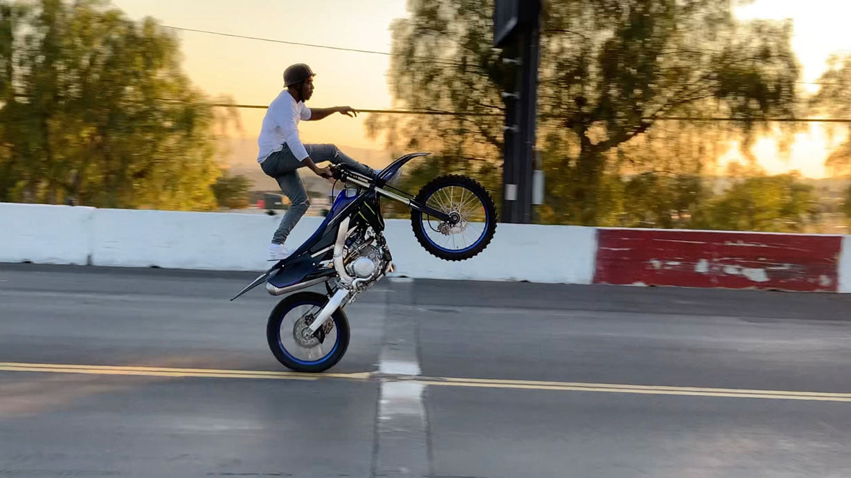 America’s Got Talent: Extreme daredevil & stunts star LeekyDaBikeStar popping wheelies on a dirt bike.